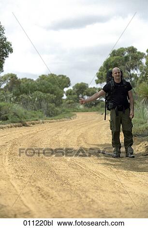 backpacker hitchhiking View Large Photo Image Stock Image - backpacker hitchhiking. Fotosearch