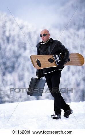 bald man carrying snowboard and briefcase View Large Photo Image Stock Image - bald man carrying snowboard and briefcase. Fotosearch