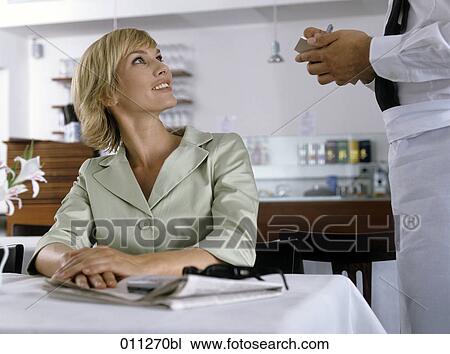 blonde businesswoman ordering in a restaurant View Large Photo Image Stock Image - blonde businesswoman ordering in a restaurant. Fotosearch