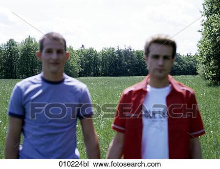 blurred portrait of gay couple (20-25 years) outdoors View Large Photo Image Stock Image - blurred portrait of gay couple (20-25 years) outdoors. Fotosearch