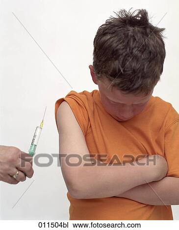 boy looking down as he is supposed to get an injection View Large Photo Image Stock Image - boy looking down as he is supposed to get an injection. Fotosearch