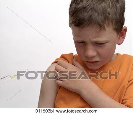 boy waiting to get an injection, looking uneasy View Large Photo Image Stock Image - boy waiting to get an injection, looking uneasy. Fotosearch