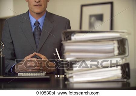 businessman behind his desk contemplating View Large Photo Image Stock Image - businessman behind his desk contemplating. Fotosearch
