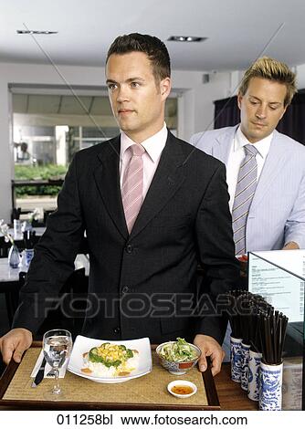 Stock Image - businessman taking his filled tray in a self-service restaurant. Fotosearch