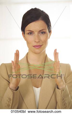 businesswoman doing the cat´s cradle with a green woolen thread View Large Photo Image Stock Image - businesswoman doing the cat´s cradle with a green woolen thread. Fotosearch