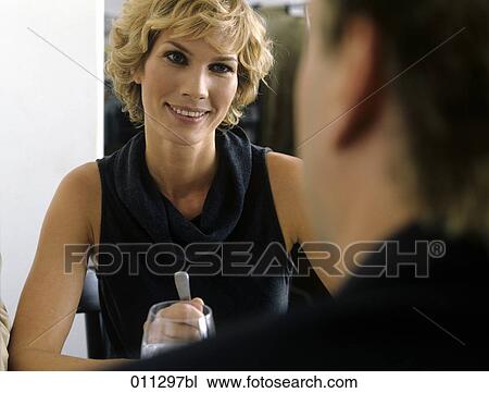 businesswoman smiling at colleague during business lunch View Large Photo Image Stock Image - businesswoman smiling at colleague during business lunch. Fotosearch