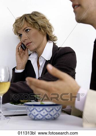 businesswoman taking a call during business lunch View Large Photo Image Stock Image - businesswoman taking a call during business lunch. Fotosearch