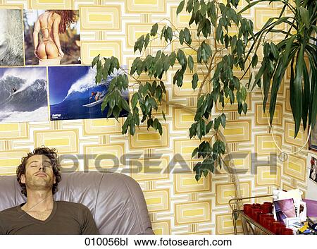 caucasian male sleeping on grey leather sofa View Large Photo Image Stock Image - caucasian male sleeping on grey leather sofa. Fotosearch
