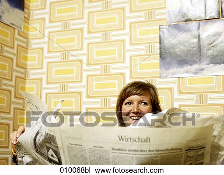 caucasian woman sitting reading newspaper View Large Photo Image Stock Image - caucasian woman sitting reading newspaper. Fotosearch
