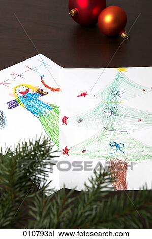 Stock Image - children drawings with christmas decoration. Fotosearch