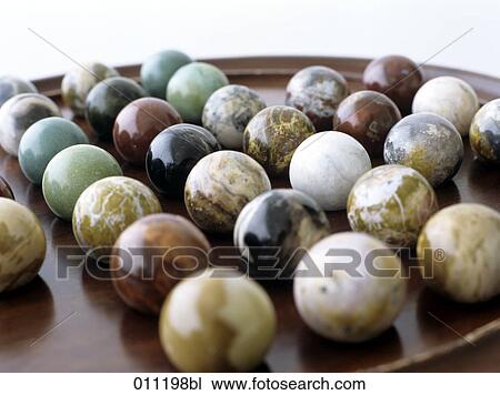 close-up of a solitaire game with marble balls View Large Photo Image Stock Image - close-up of a solitaire game with marble balls. Fotosearch