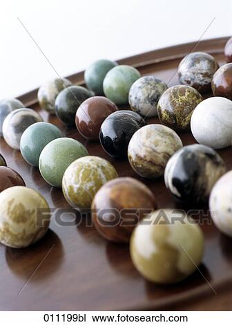 close-up of a solitaire game with marble balls View Large Photo Image Stock Image - close-up of a solitaire game with marble balls. Fotosearch