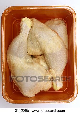 Stock Image - close-up of chicken legs in package . Fotosearch