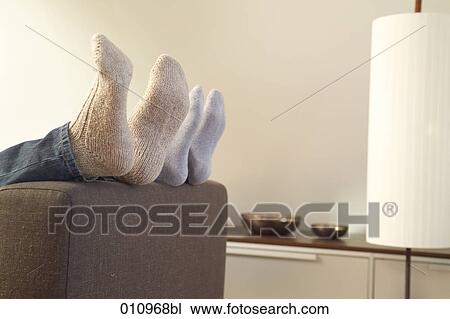 Stock Image - Close-up of feet in woolly socks. Fotosearch
