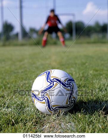 Stock Image - close-up of football lying on penalty spot . Fotosearch