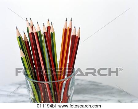 Stock Image - close-up of glass with colored pencils. Fotosearch
