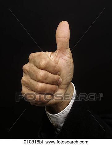 Stock Image - Close-up of human hand showing the thumbs up sign. Fotosearch