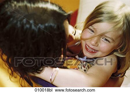 close up of little girl in woman´s arms View Large Photo Image Stock Image - close up of little girl in woman´s arms. Fotosearch