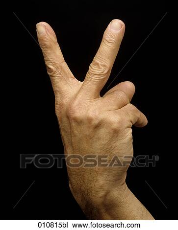 Close-up of male hand giving up yours sign View Large Photo Image Stock Image - Close-up of male hand giving up yours sign. Fotosearch