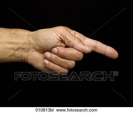 Stock Image - Close-up of male hand pointing with index finger. Fotosearch