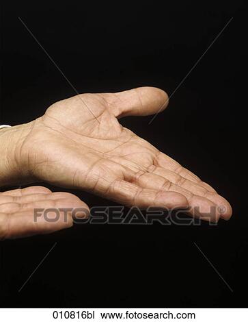 Stock Image - Close-up of male hand showing it´s palm. Fotosearch