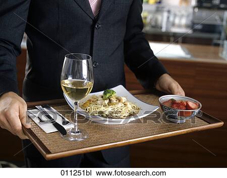 close-up of man in suit carrying a tray in a self-service restaurant View Large Photo Image Stock Image - close-up of man in suit carrying a tray in a self-service restaurant. Fotosearch