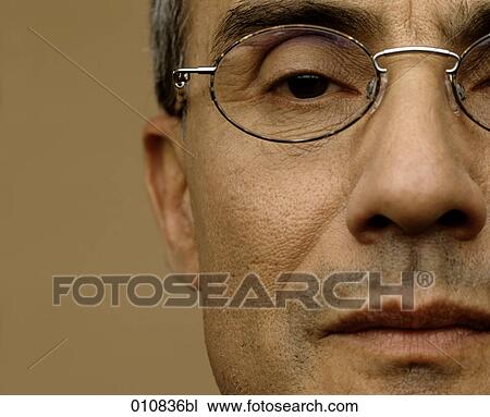 Close-up of mature man wearing spectacles View Large Photo Image Stock Image - Close-up of mature man wearing spectacles. Fotosearch