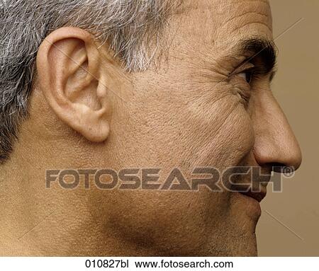 Close-up of smiling mature man View Large Photo Image Stock Image - Close-up of smiling mature man. Fotosearch