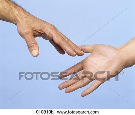 Close-up of two hands trying to touch View Large Photo Image Stock Image - Close-up of two hands trying to touch. Fotosearch