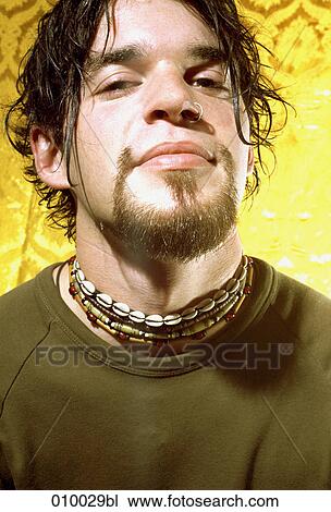 close-up portrait of a young man with beard and pierced nose View Large Photo Image Stock Image - close-up portrait of a young man with beard and pierced nose. Fotosearch