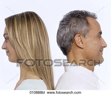 close-up portrait of mature man and young woman back to back View Large Photo Image Stock Image - close-up portrait of mature man and young woman back to back. Fotosearch