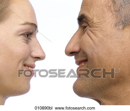 close-up portrait of mature man and young woman smiling View Large Photo Image Stock Image - close-up portrait of mature man and young woman smiling. Fotosearch
