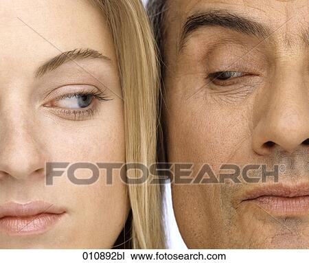 close-up portrait of mature man and young woman looking sceptical View Large Photo Image Stock Image - close-up portrait of mature man and young woman looking sceptical. Fotosearch