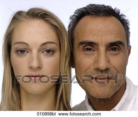 Stock Image - close-up portrait of mature man and young woman. Fotosearch