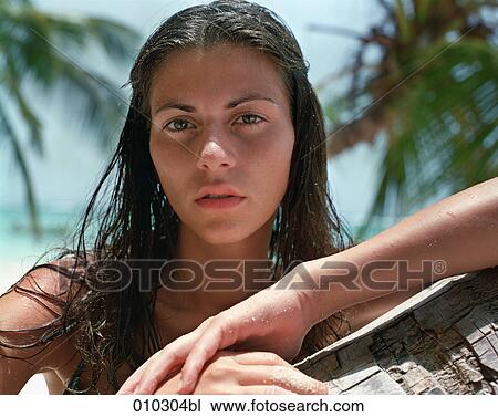 close-up portrait of woman (25-30 years) in tropical environment View Large Photo Image Stock Image - close-up portrait of woman (25-30 years) in tropical environment. Fotosearch