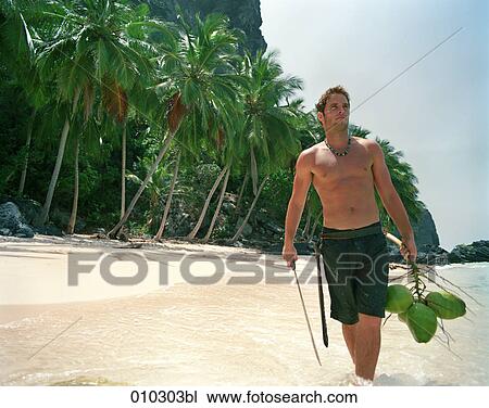 cool man (30-35 years) walking on beach with coconuts View Large Photo Image Stock Image - cool man (30-35 years) walking on beach with coconuts. Fotosearch