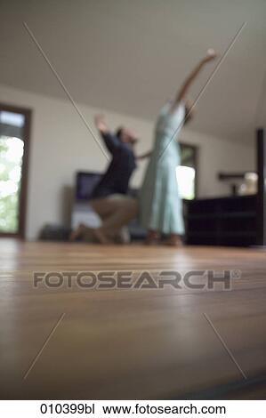 couple dancing in large living room (blurred image) View Large Photo Image Stock Image - couple dancing in large living room (blurred image). Fotosearch