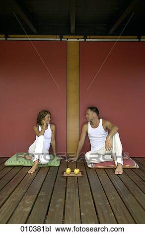 couple exercising and meditating on veranda View Large Photo Image Stock Image - couple exercising and meditating on veranda. Fotosearch