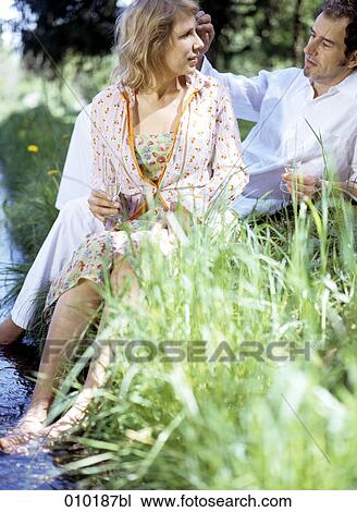 couple having picnic in a park View Large Photo Image Stock Image - couple having picnic in a park. Fotosearch