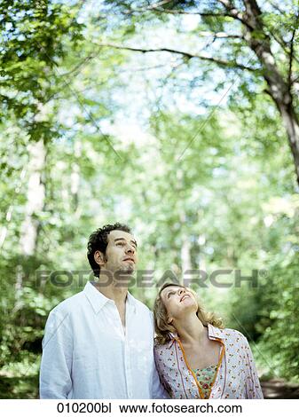 couple in the park enjoying the surroundings View Large Photo Image Stock Image - couple in the park enjoying the surroundings. Fotosearch