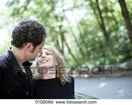 couple kissing each other View Large Photo Image Stock Image - couple kissing each other. Fotosearch