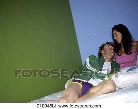 couple lying on mattress, relaxed and looking at each other View Large Photo Image Stock Image - couple lying on mattress, relaxed and looking at each other. Fotosearch