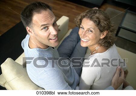 couple on sofa looking up View Large Photo Image Stock Image - couple on sofa looking up. Fotosearch