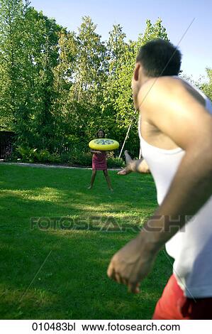 couple playing frisbee in garden View Large Photo Image Stock Image - couple playing frisbee in garden. Fotosearch