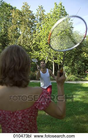 couple playing in garden playing badminton View Large Photo Image Stock Image - couple playing in garden playing badminton. Fotosearch