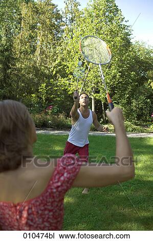 couple playing in garden playing badminton View Large Photo Image Stock Image - couple playing in garden playing badminton. Fotosearch