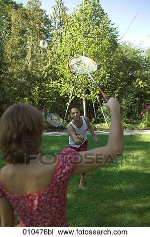 couple playing in garden playing badminton View Large Photo Image Stock Image - couple playing in garden playing badminton. Fotosearch