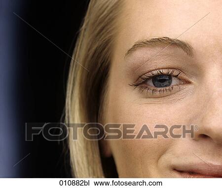 Stock Image - Detail of blonde woman´s face. Fotosearch