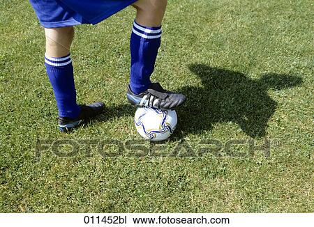 detail of football player standing on ball View Large Photo Image Stock Image - detail of football player standing on ball. Fotosearch