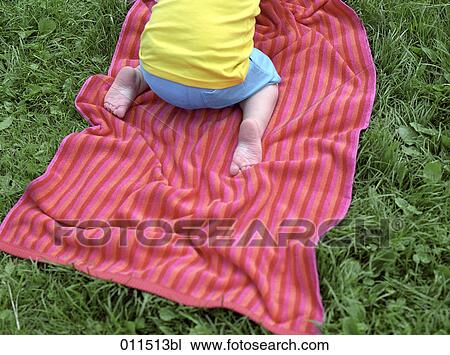 detail of little child on towel outdoors View Large Photo Image Stock Image - detail of little child on towel outdoors. Fotosearch